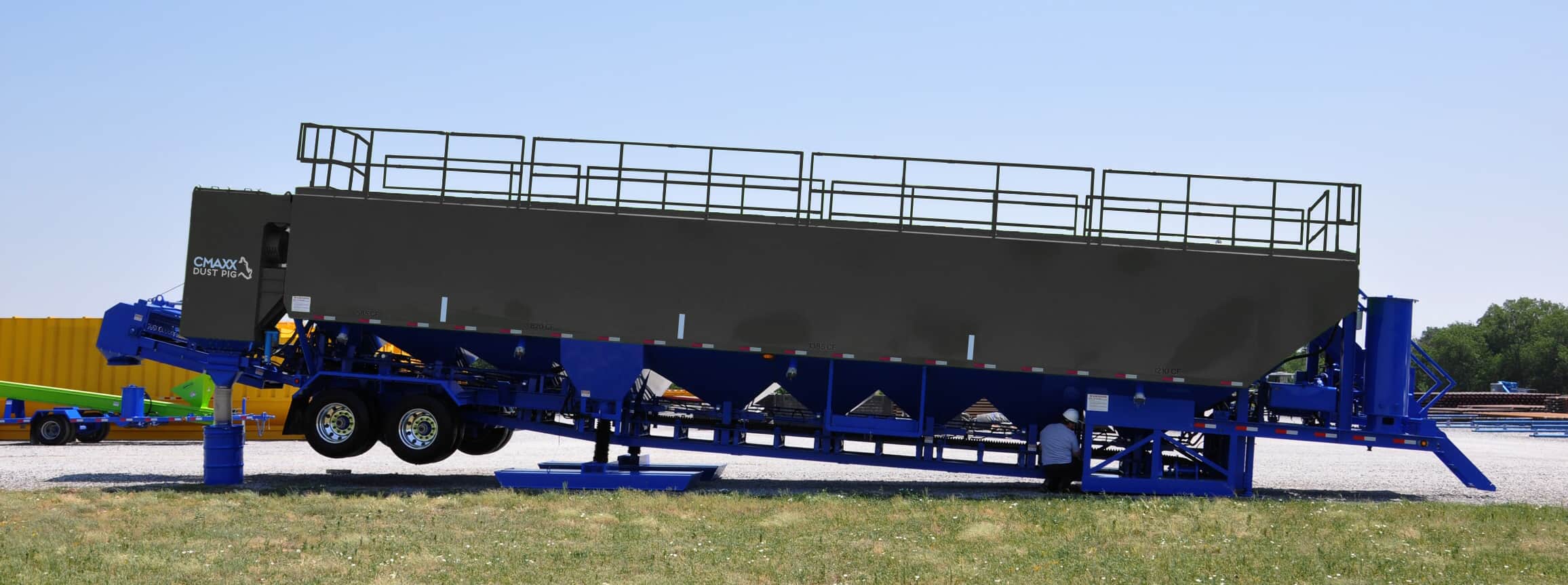 CMAXX Dust Pig installed on a sand storage truck that feeds a conveyor at a fracking worksite