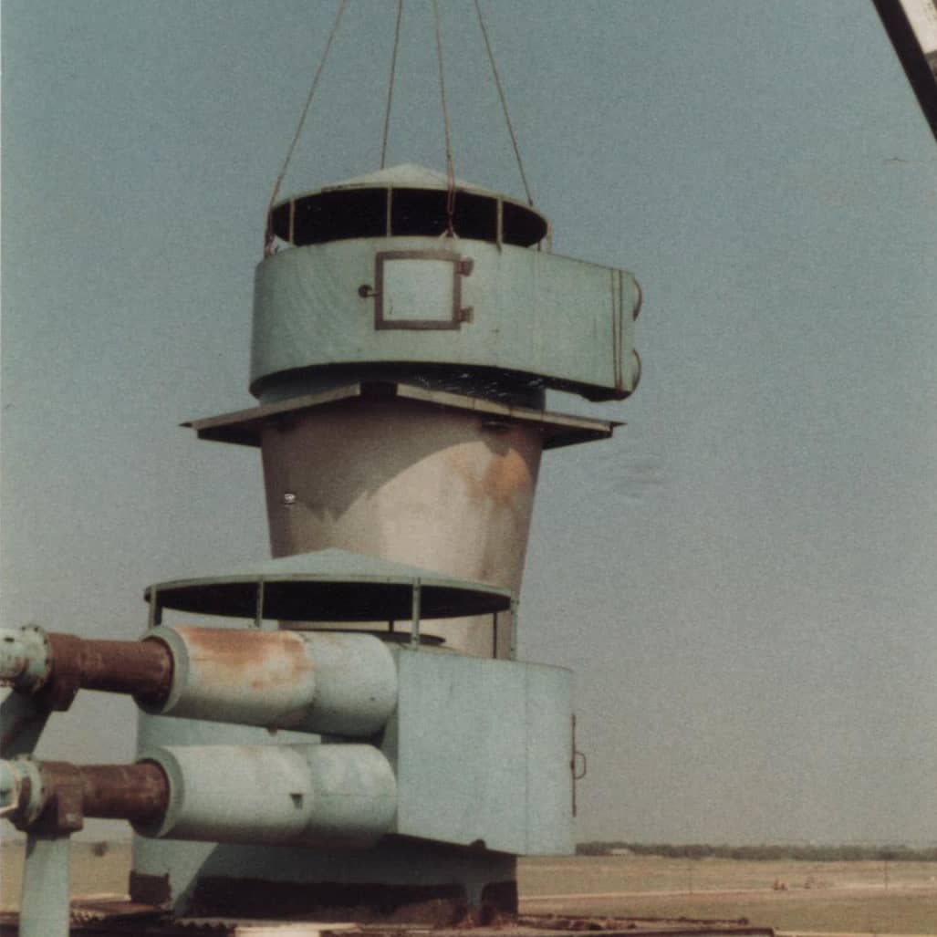 Old photo of an industrial cyclone being installed