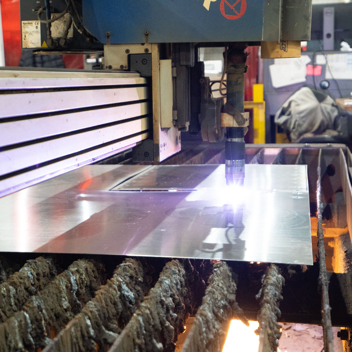 Plasma cutting machine in operation creating dangerous fumes