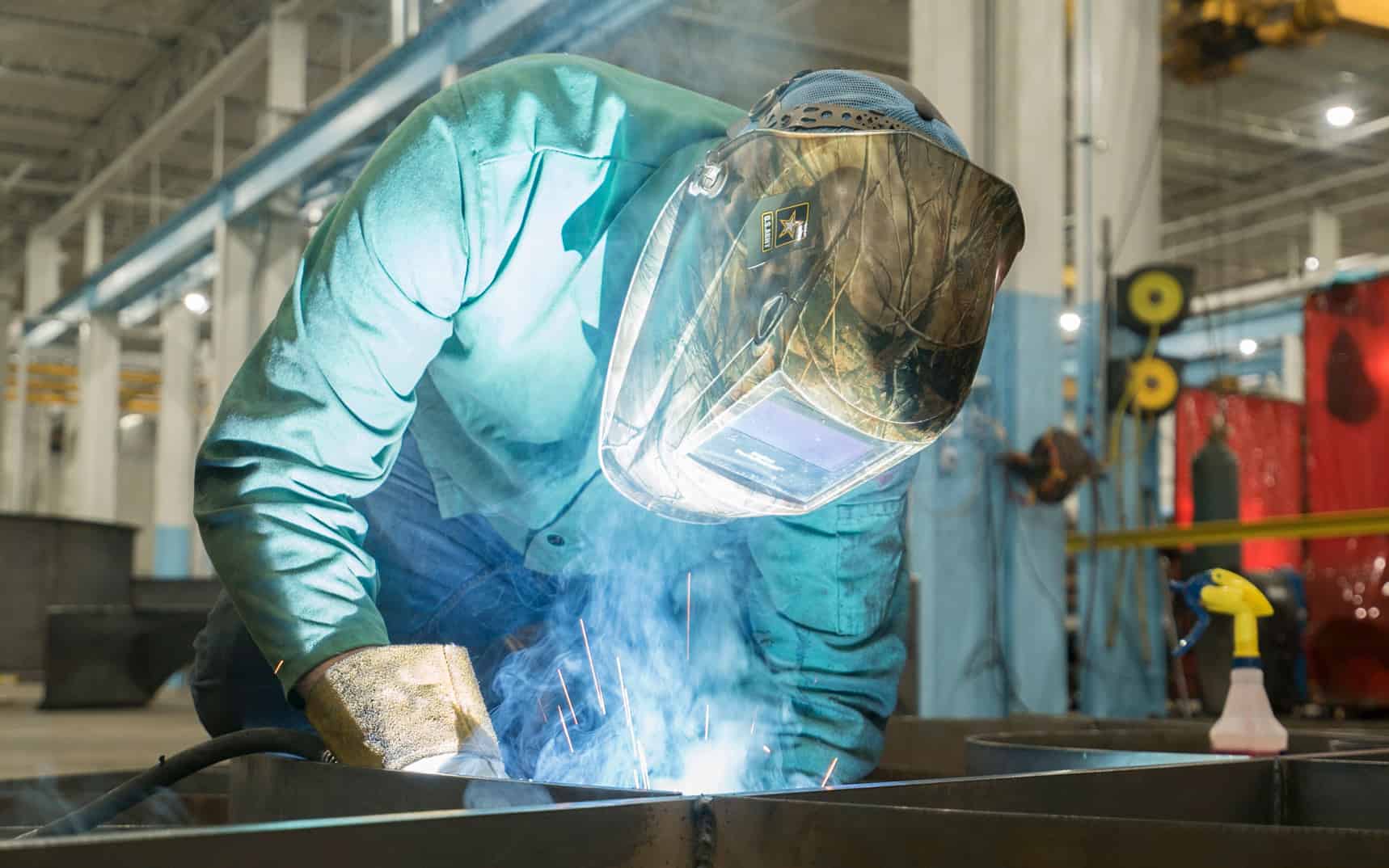 A welder at work in Imperial Systems' industrial dust and fume collector factory