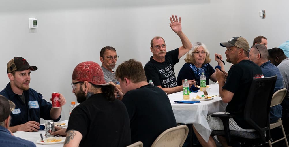 Carl Callen waving at retirement luncheon