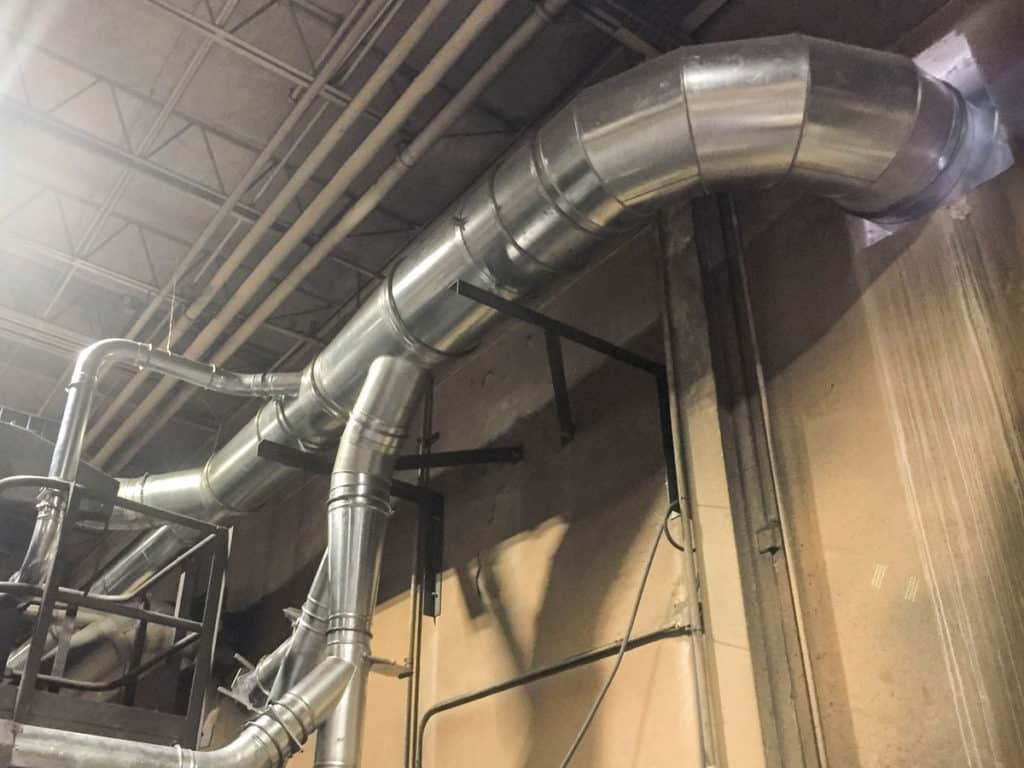 Properly installed ductwork from dust collector to tumble blast surface prep machines