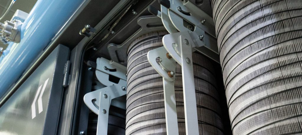 View of vertical filters in a dust collector. Short filter life is an indicator of an undersized dust collector