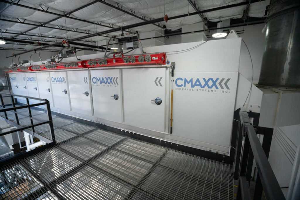 CMAXX dust and fume collection system installation at an automotive outfitter shop