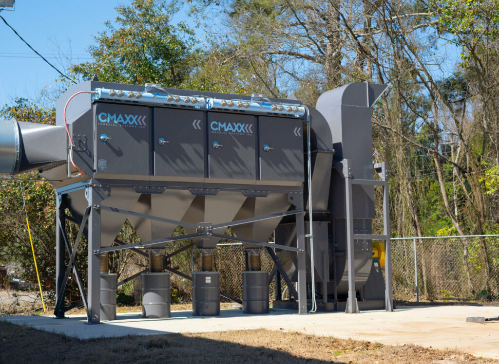 A dust collector sitting outside of a welding school