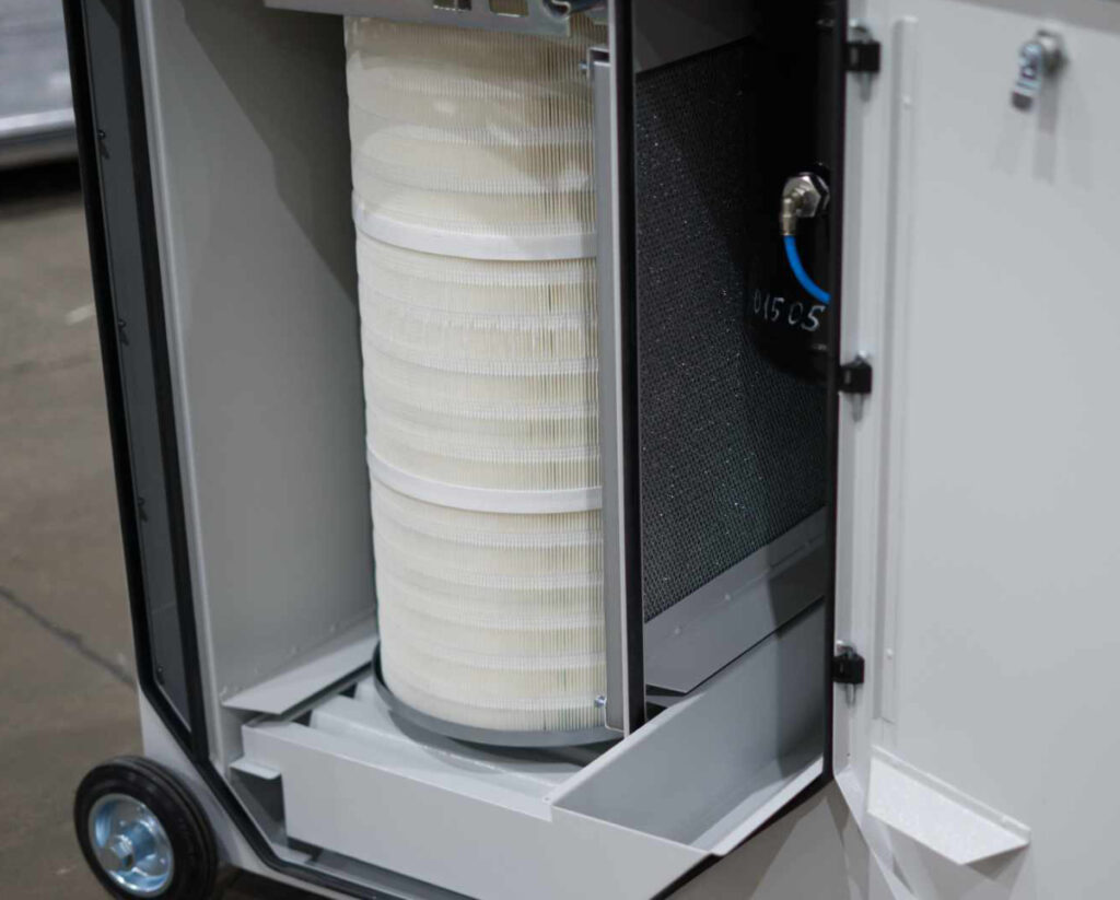 The metal mesh shows an integrated spark arrestor for a weld fume collector, which knocks sparks out of the airstream and into the removable tray below.